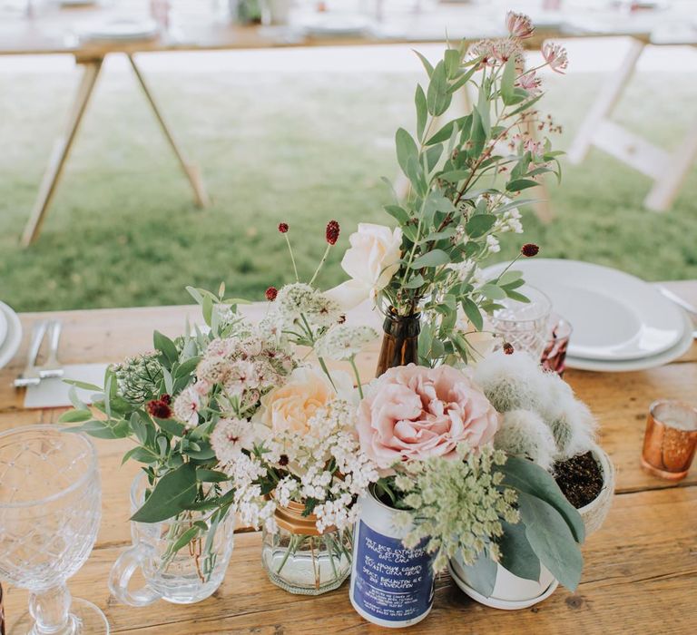 Flowers and foliage in cases at Brickhouse Vineyard wedding