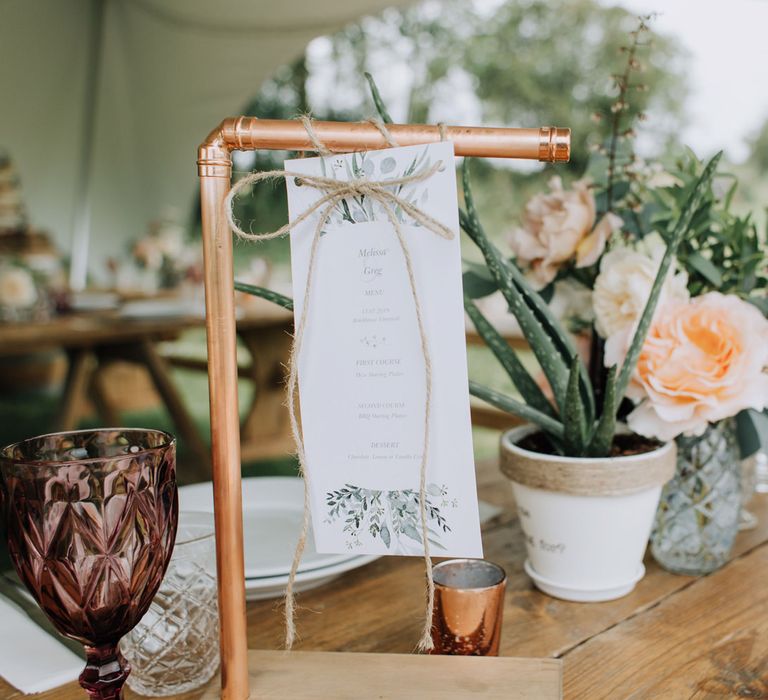 Copper pipe with hanging menu card