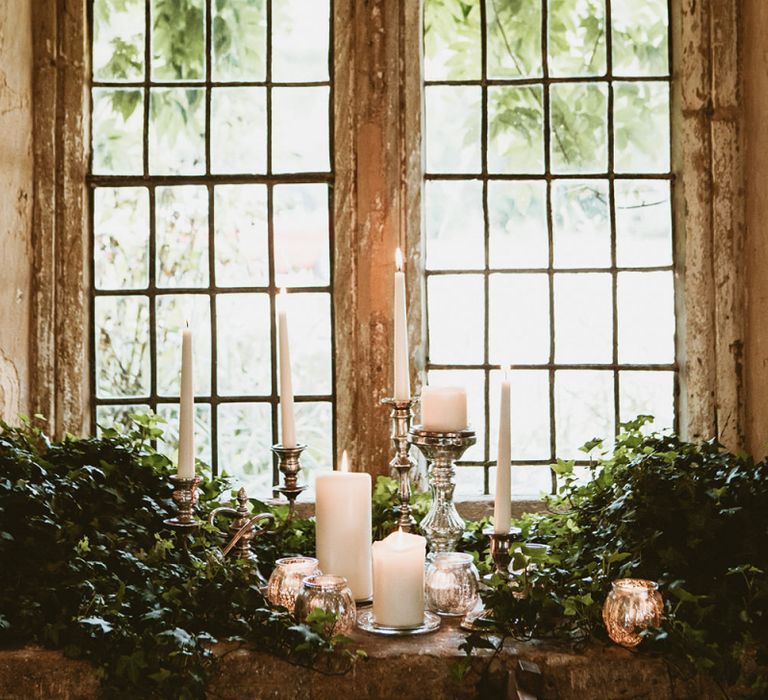 Silver Candlesticks and Foliage Wedding Decor