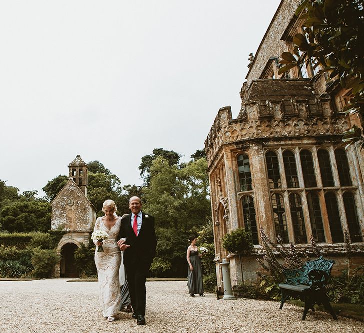 Father of the Bride Escorting his Daughter in a Vintage Style Wedding Dress to the Civil Ceremony