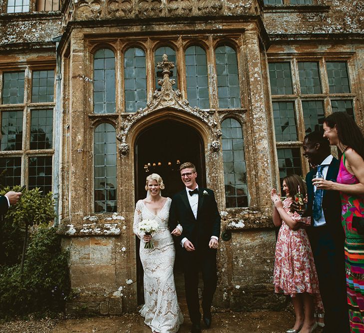 Bride in Vintage Lace Tara Lauren Wedding Dress and Groom in Tuxedo