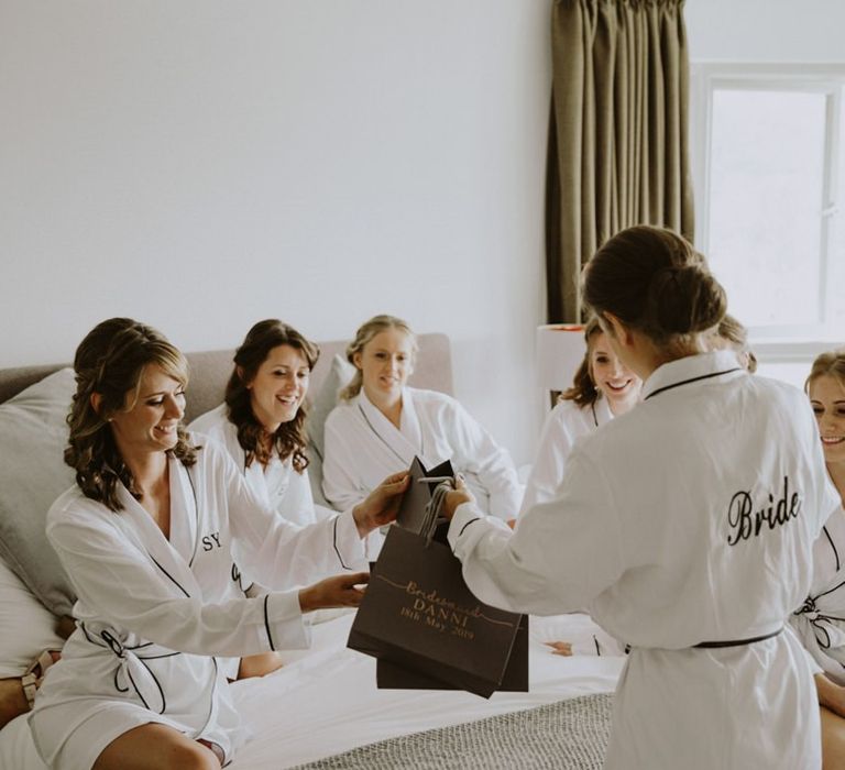 Bridal party in personalised robes at Lulworth Castle wedding