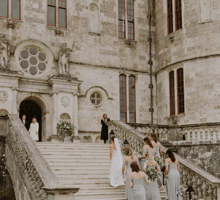 Bridal party make their way to Lulworth Castle wedding