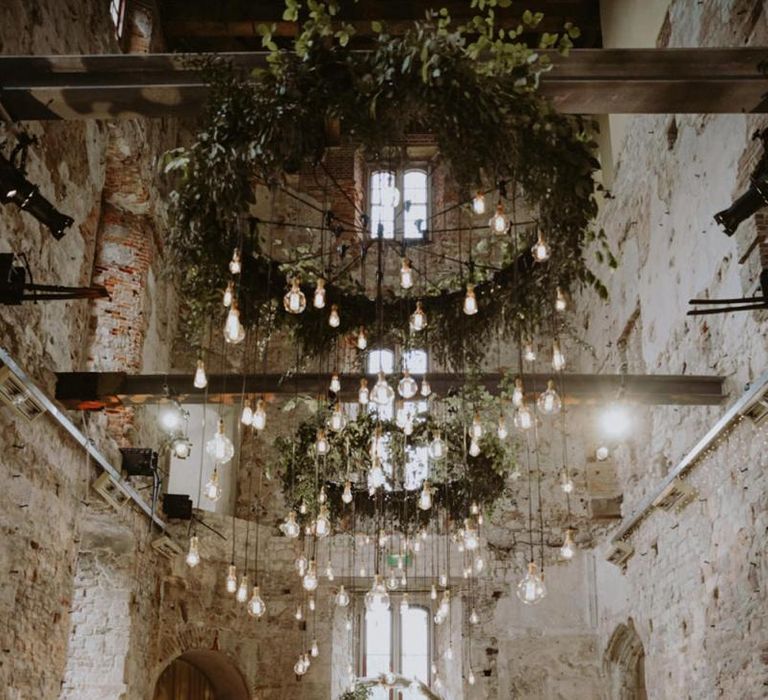 hanging foliage chandelier and light installation at Lulworth Castle wedding