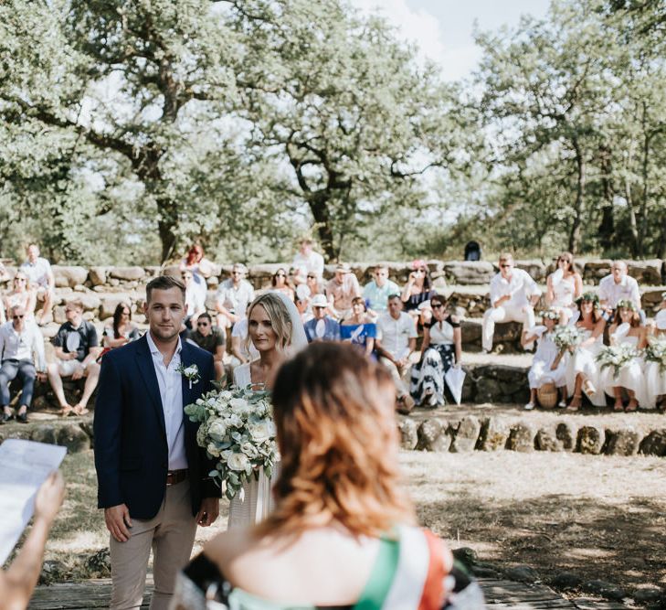 Outdoor Wedding Ceremony | Bride in Spell &amp; the Gypsy Collective Bell Sleeve Wedding Dress | Groom in Chino's &amp; Blazer | Outdoor Bohemian Destination Wedding at La Selva, Tuscany | Damien Milan Photography