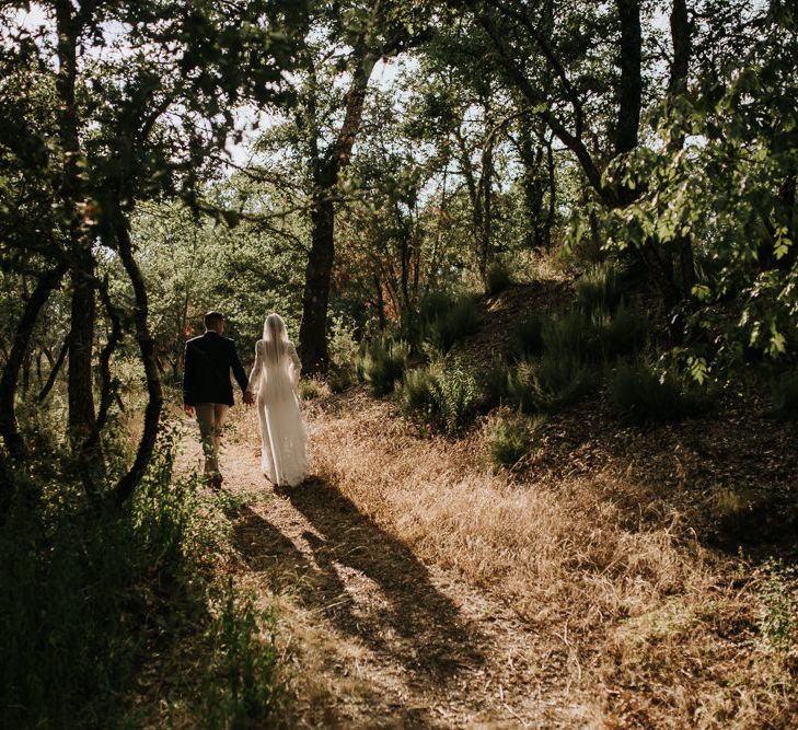 Bride in Spell &amp; the Gypsy Collective Bell Sleeve Wedding Dress | Groom in Chino's &amp; Blazer | Outdoor Bohemian Destination Wedding at La Selva, Tuscany | Damien Milan Photography