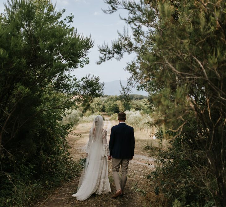 Bride in Spell &amp; the Gypsy Collective Bell Sleeve Wedding Dress | Groom in Chino's &amp; Blazer | Outdoor Bohemian Destination Wedding at La Selva, Tuscany | Damien Milan Photography