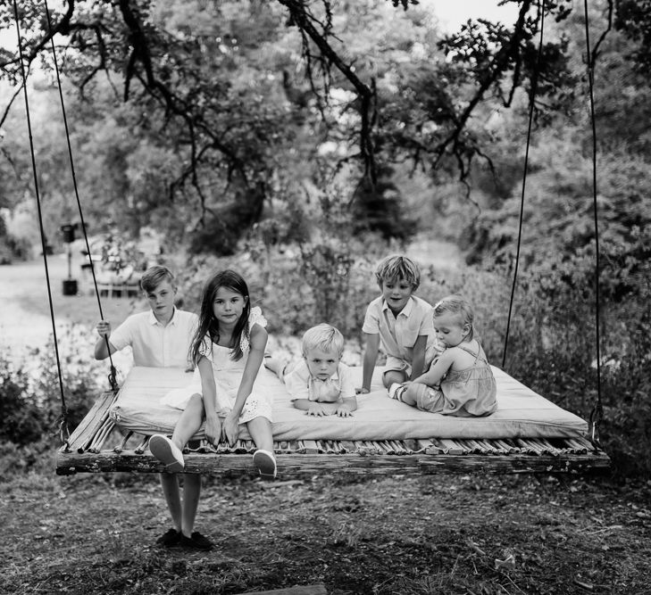 Children on a Swing | Outdoor Bohemian Destination Wedding at La Selva, Tuscany | Damien Milan Photography