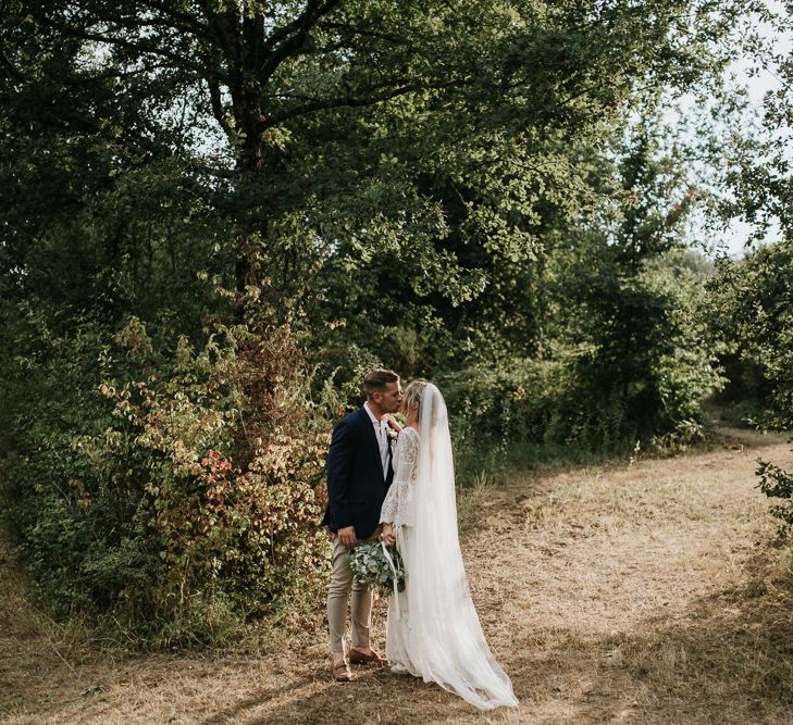 Bride in Spell &amp; the Gypsy Collective Bell Sleeve Wedding Dress | Groom in Chino's &amp; Blazer | Outdoor Bohemian Destination Wedding at La Selva, Tuscany | Damien Milan Photography