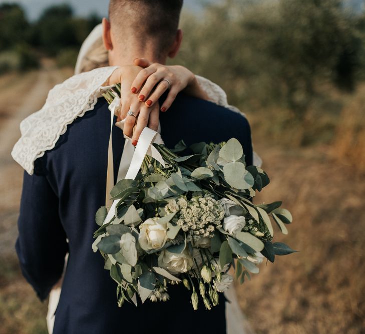 White &amp; Green Bouquet | Bride in Spell &amp; the Gypsy Collective Bell Sleeve Wedding Dress | Groom in Chino's &amp; Blazer | Outdoor Bohemian Destination Wedding at La Selva, Tuscany | Damien Milan Photography