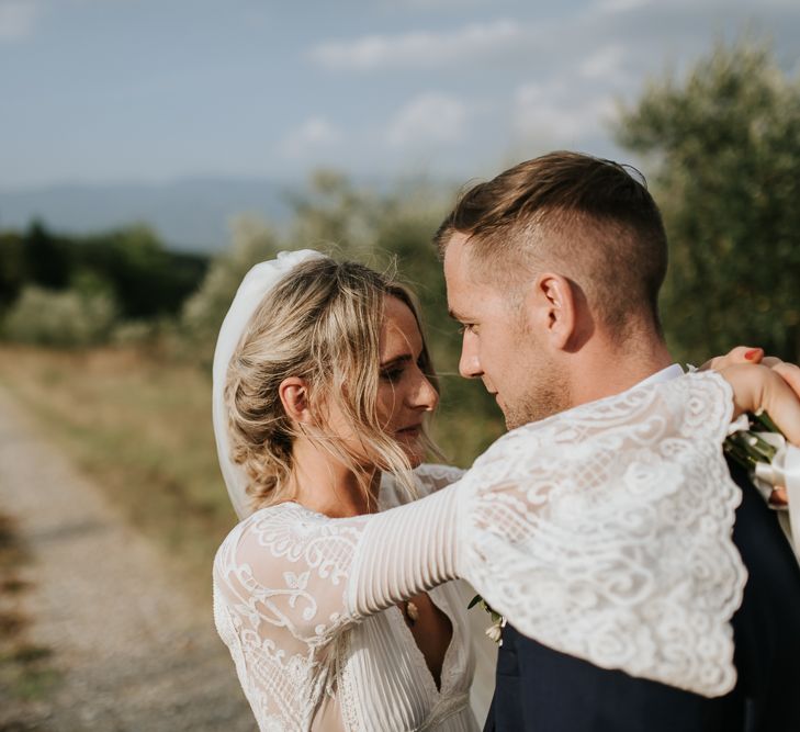 Bride in Spell &amp; the Gypsy Collective Bell Sleeve Wedding Dress | Groom in Chino's &amp; Blazer | Outdoor Bohemian Destination Wedding at La Selva, Tuscany | Damien Milan Photography