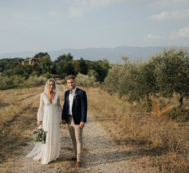 Bride in Spell &amp; the Gypsy Collective Bell Sleeve Wedding Dress | Groom in Chino's &amp; Blazer | Outdoor Bohemian Destination Wedding at La Selva, Tuscany | Damien Milan Photography