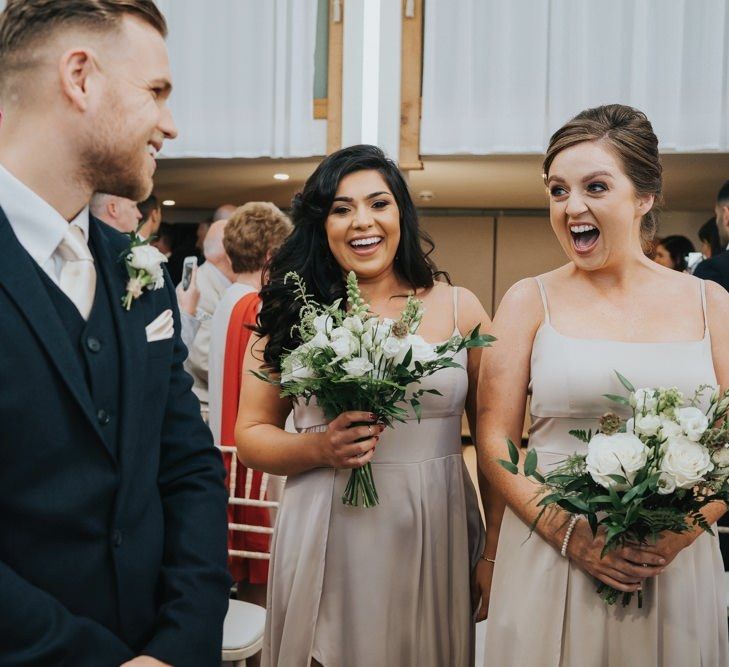 Bridesmaids walk down the aisle at civil  ceremony