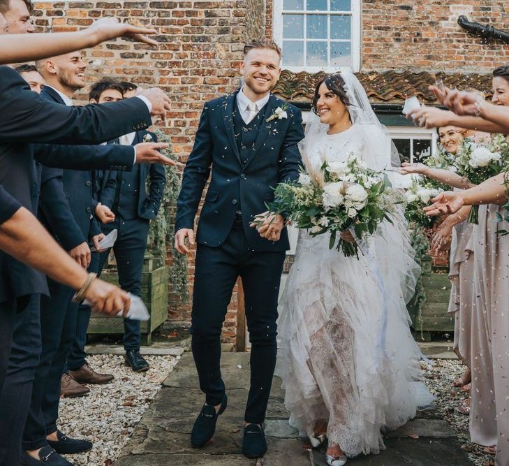 Confetti exit for bride and groom after civil ceremony