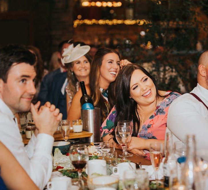 Guests enjoy wedding speeches