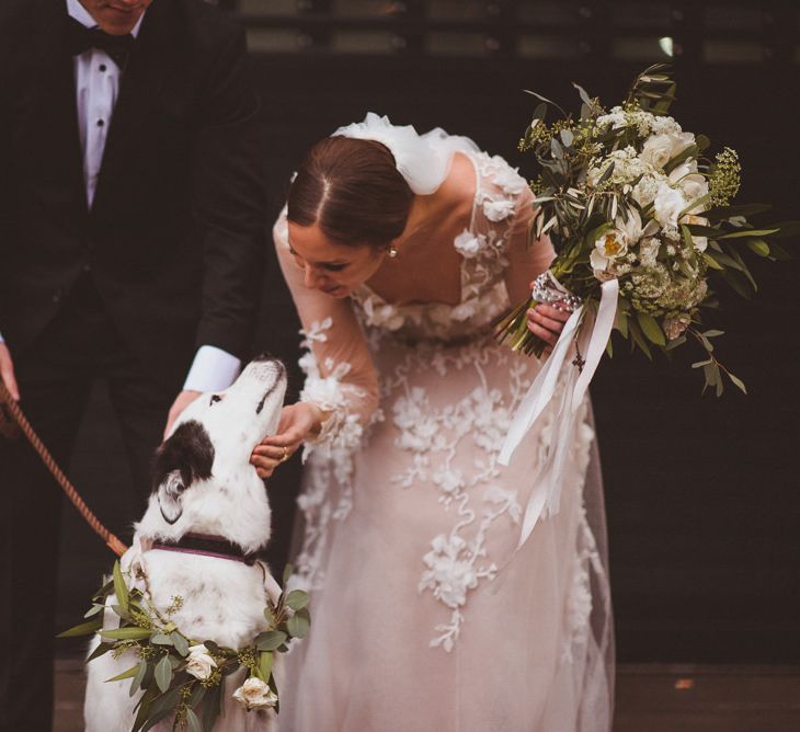 Bride in Marchesa wedding dress with her pet dog