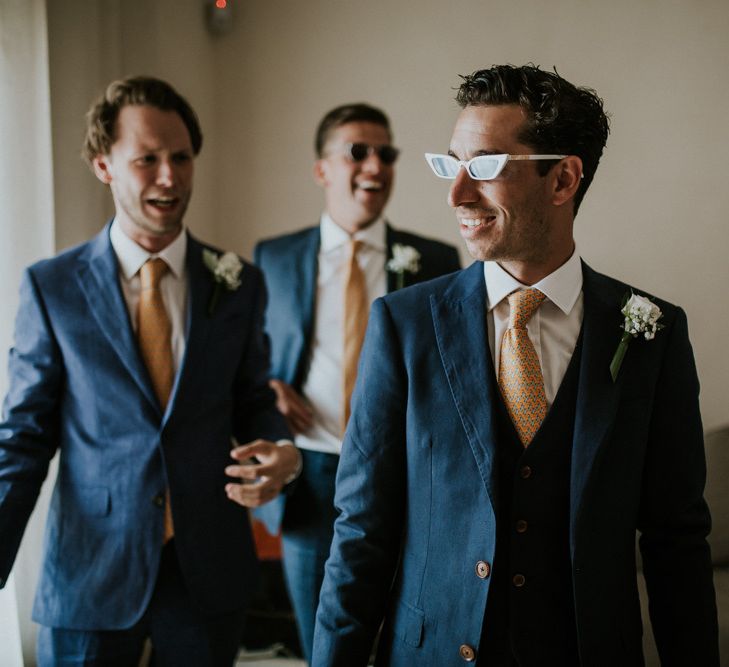 Groomsmen in Navy Suits with Orange Ties