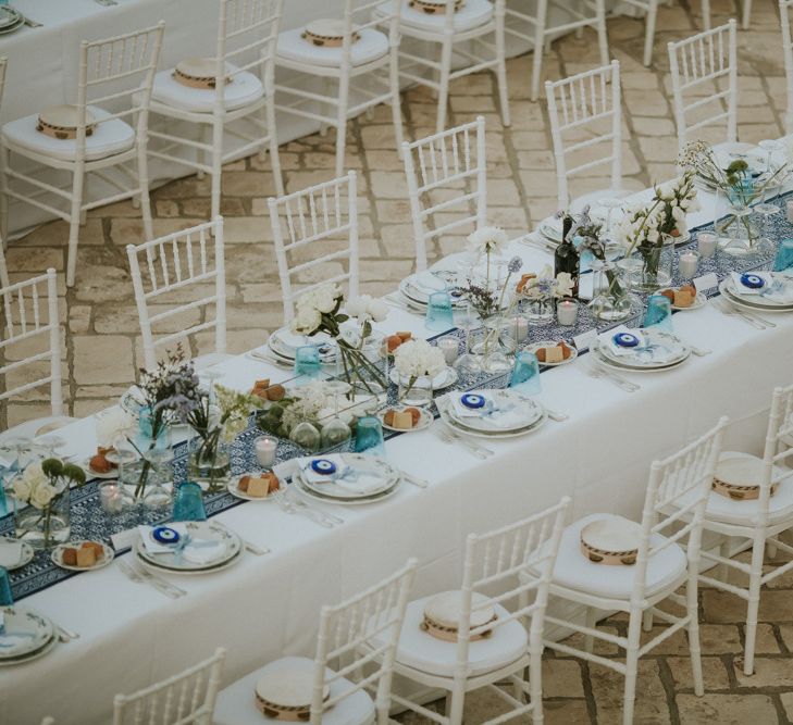 Outdoor Wedding Ceremony with Blue and White Table Runner and Tambourine Wedding Favours