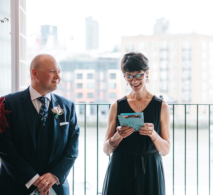 Bride in Halfpenny London Dress with Cowl Back and Half Length Sleeves | Tilly Thomas Lux Headband | Groom in Blue Three-Piece Suit and White Trainers | Wedding Ceremony at The Swan at The Globe | Meringue Kisses &amp; Colourful Wedding Flowers &amp; Stationery for a London Wedding at The Globe | Miss Gen