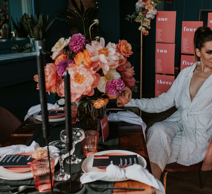 Stylish Bride in Sequin Jump-suit Sitting at Retro Tablescape