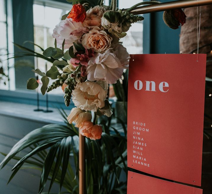 Wedding Flowers Decorating the Corner of the Metal Frame Table Plan