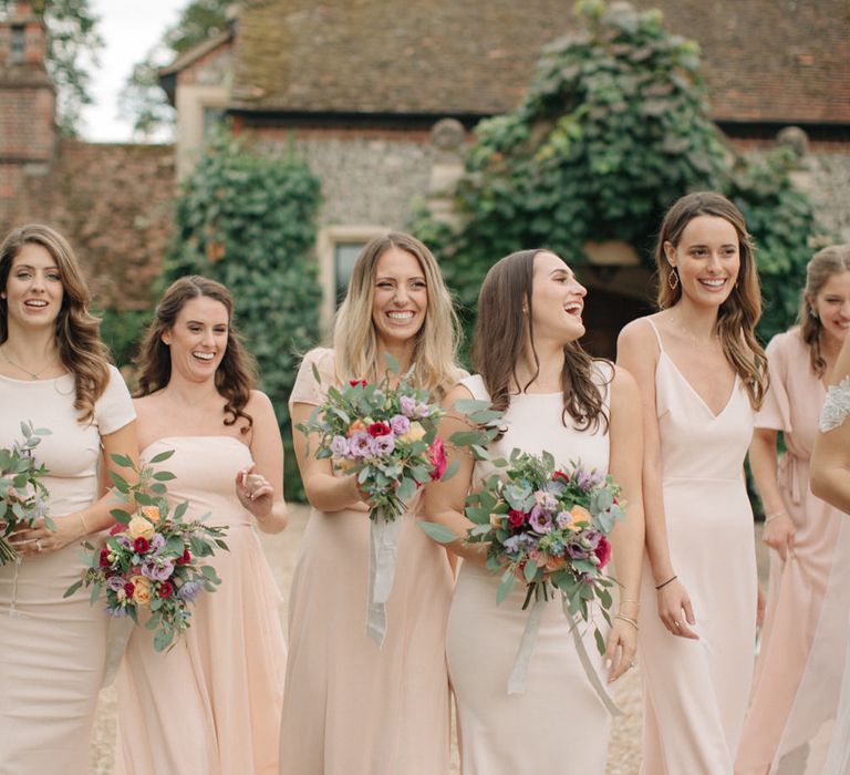 Bridesmaids in Peach Revolve Dresses | Contemporary Elegance Wedding in the Countryside  | M &amp; J Photography | Film by Jacob and Pauline