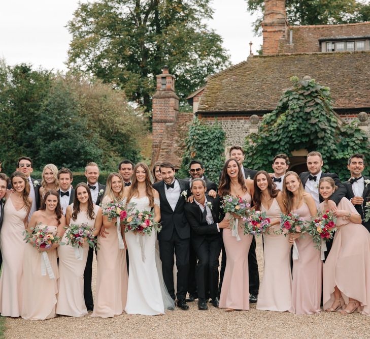 Wedding Party | Bride in Pronovias Wedding Dress | Bridesmaids in Peach Revolve Dresses | Groomsmen in Black Tie Suit | Contemporary Elegance Wedding in the Countryside  | M &amp; J Photography | Film by Jacob and Pauline