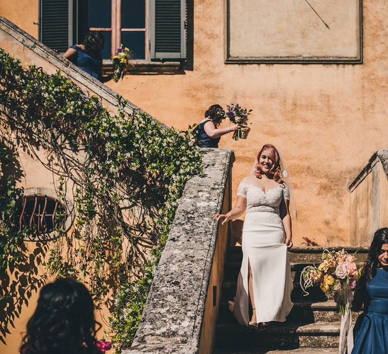 Bride with pink hair and wearing Watters wedding dress