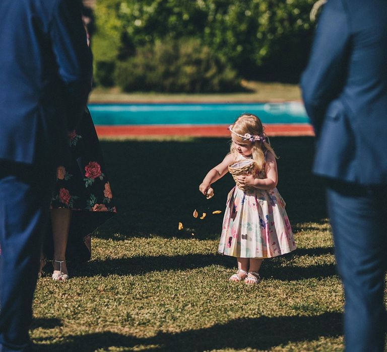 Flower girl wearing pastel dress and flower crown