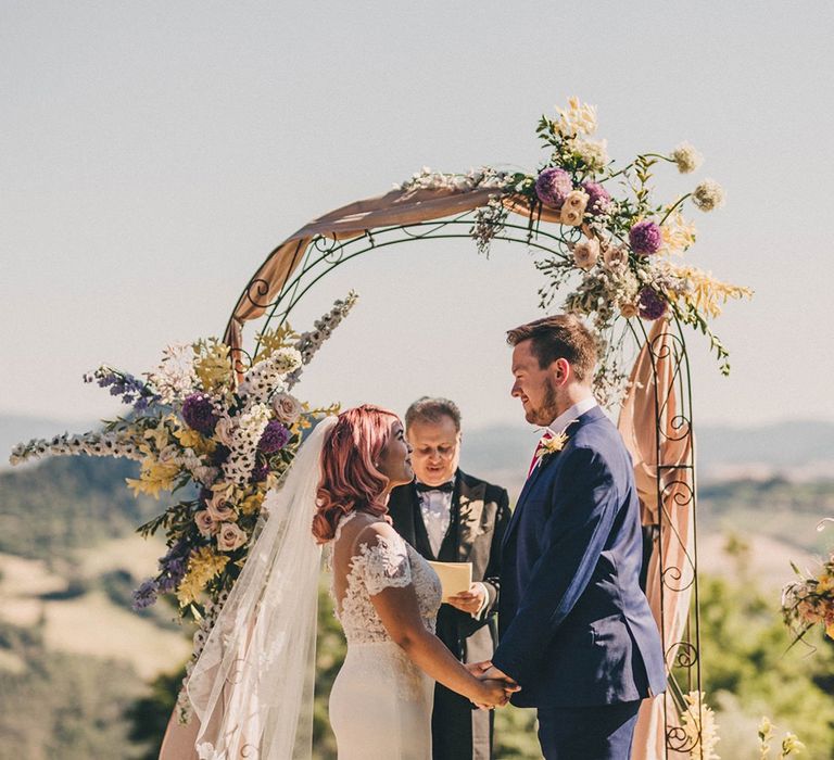 Pretty wedding arch with flowers at Villa di Ulignano