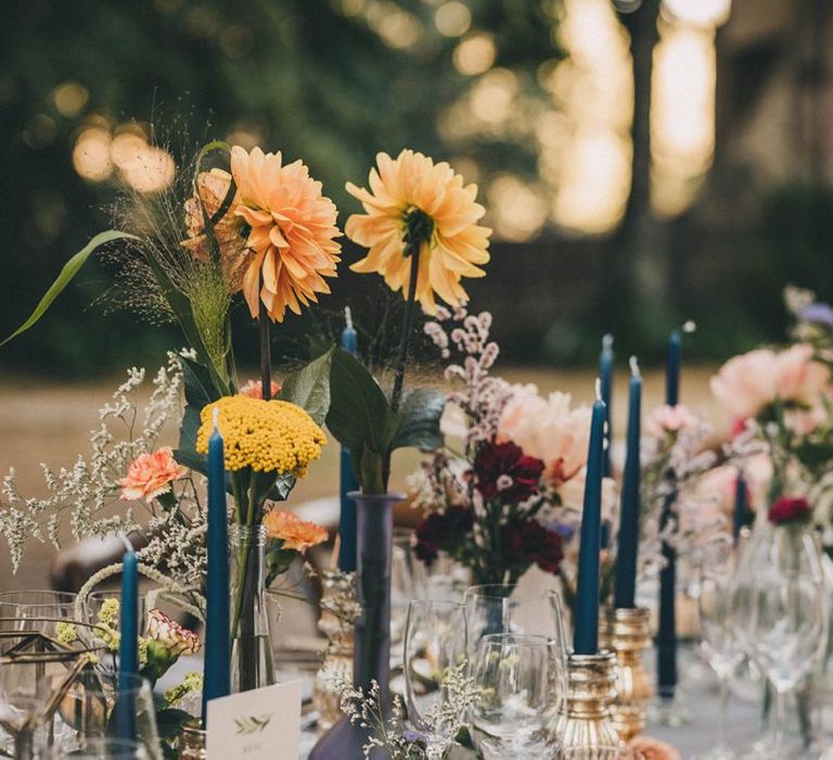 Wedding table decor with pink and yellow flowers at Villa di Ulignano