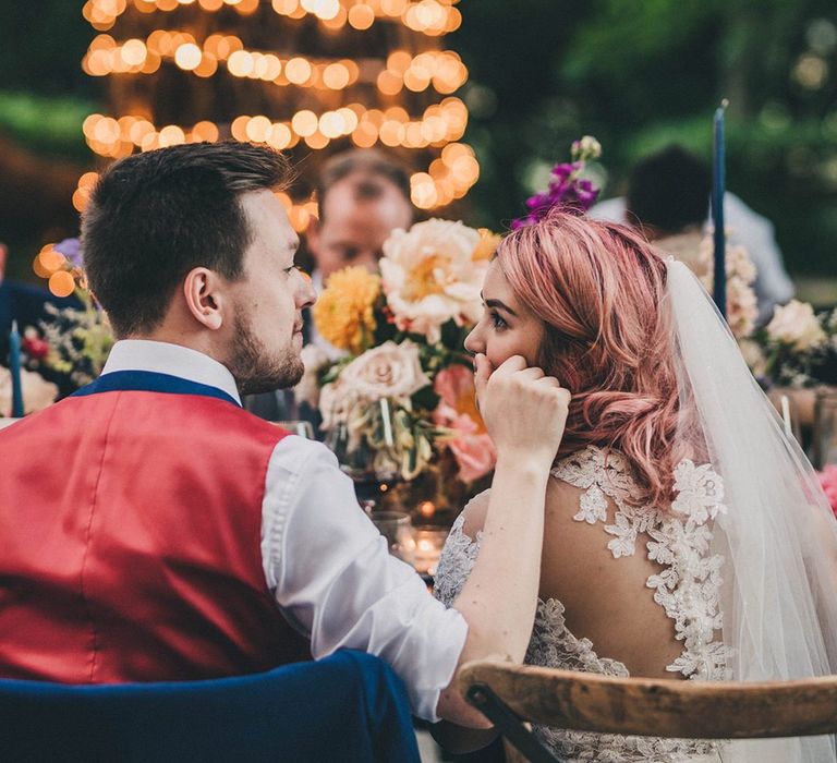 Bride and groom during outside wedding breakfast at Villa di Ulignano