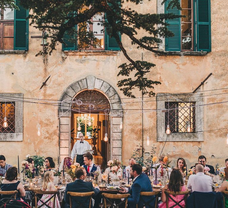 Banquet table at outdoor wedding breakfast at Villa di Ulignano