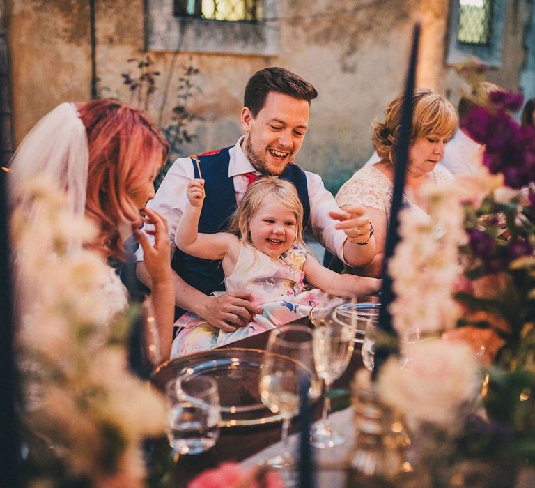 Groom enjoys wedding with guests