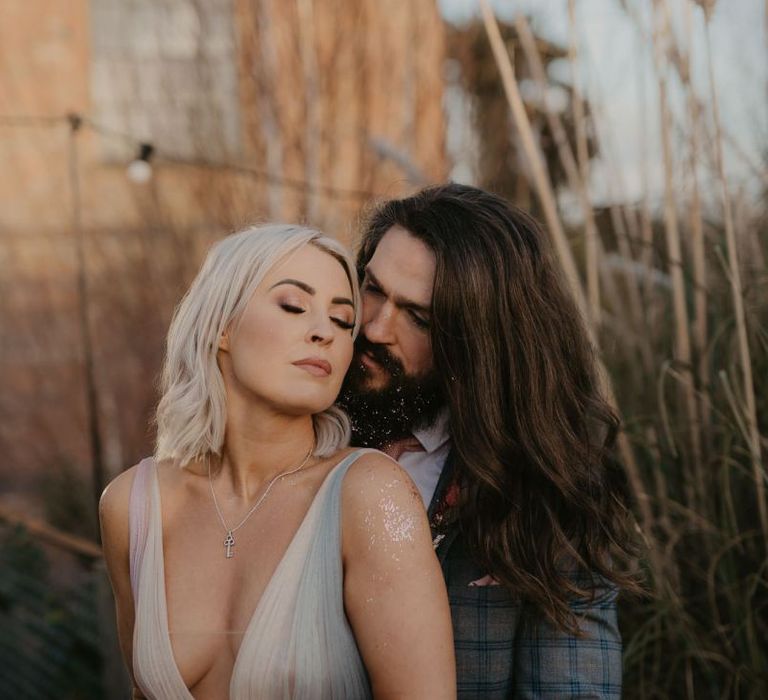 Intimate bride and groom portrait with bride in  tulle wedding dress