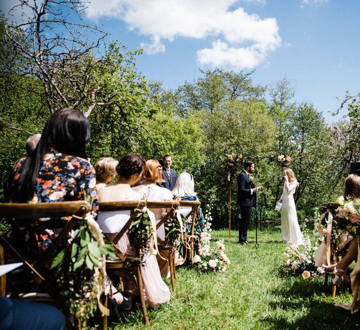 Bride and Groom Exchanging Vows at Outdoor Anran Wedding Ceremony