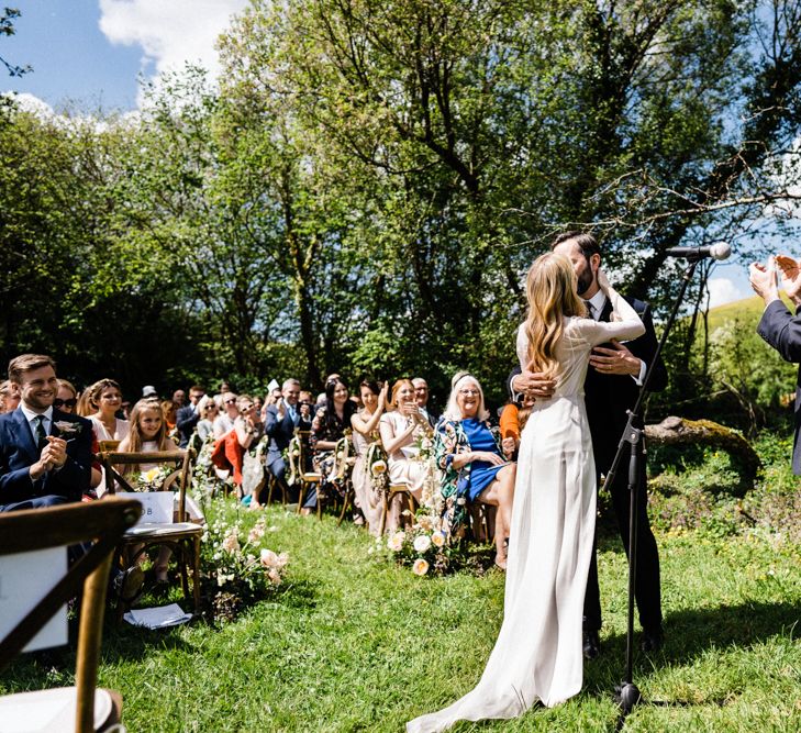 Bride and Groom Kiss at Outdoor Anran Wedding Ceremony