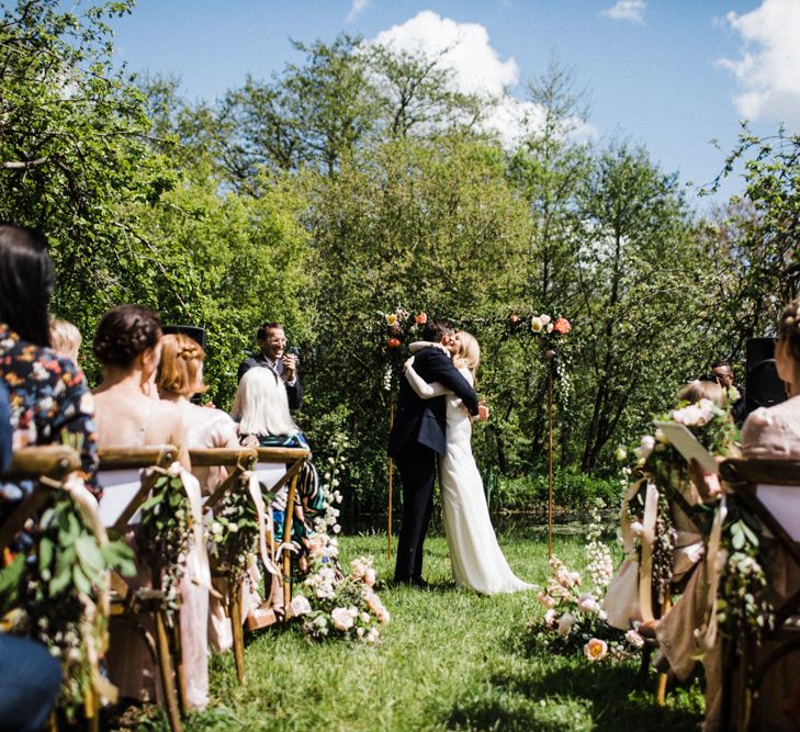 Bride and Groom Embrace at Outdoor Anran Wedding Ceremony