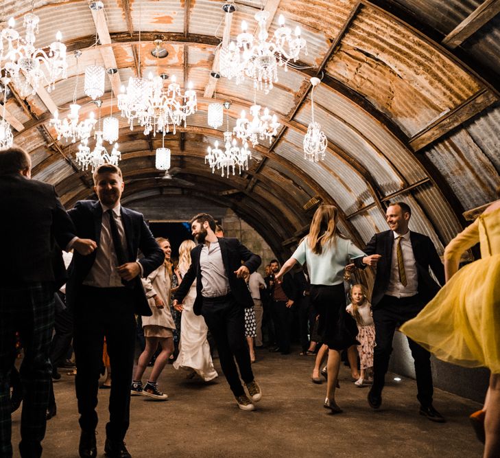 Chandelier Lit Cowshed Wedding Reception