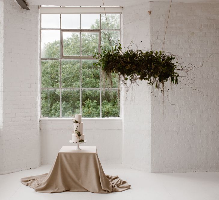 Three Tier Wedding Cake With White Icing And Foliage Decoration // Minimalist Bridal Inspiration Styled By One Stylish Day With Foliage &amp; Dried Flowers // Bridal Wear By Halfpenny London // Images By Agnes Black