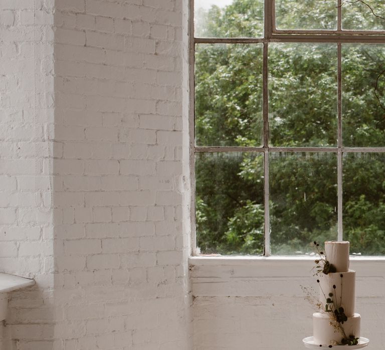 Three Tier Wedding Cake With White Icing And Foliage Decoration // Minimalist Bridal Inspiration Styled By One Stylish Day With Foliage &amp; Dried Flowers // Bridal Wear By Halfpenny London // Images By Agnes Black