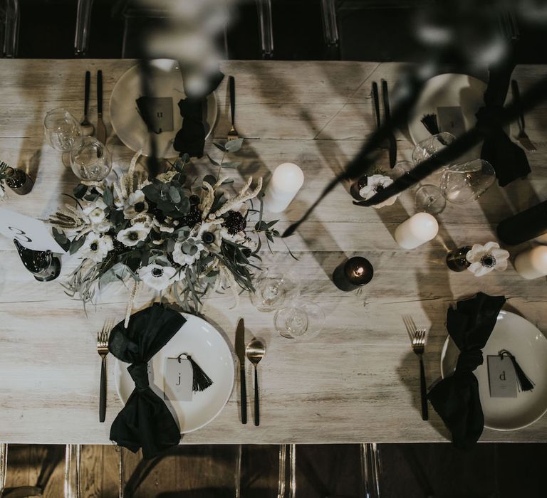 Elegant Tablescape with Ghost Chairs &amp; Hanging Anemone Floral Arrangement | Minimalist Monochrome Inspiration with Anemone's &amp; White Genista Flowers styled by The Bijou Bride | Igor Demba Photography | Gione da Silva  Film