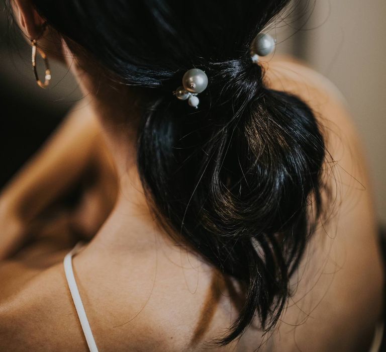 Bridal Ponytail with Pearl Hair Bobble | Minimalist Monochrome Inspiration with Anemone's &amp; White Genista Flowers styled by The Bijou Bride | Igor Demba Photography | Gione da Silva  Film