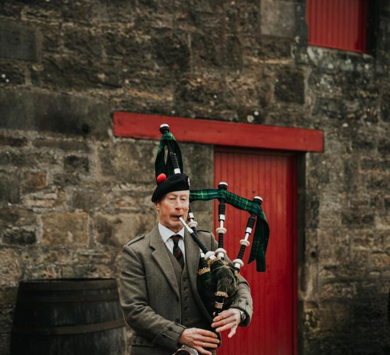 Bagpipe player at Kinkell Byre wedding in Scotland