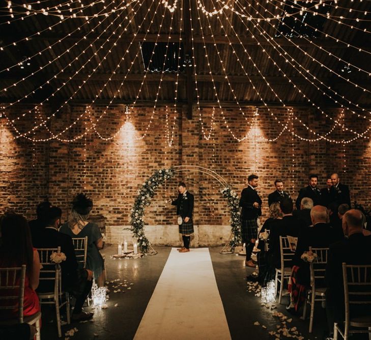 Fairy light canopy and moon gate at Kinkell Byre wedding ceremony