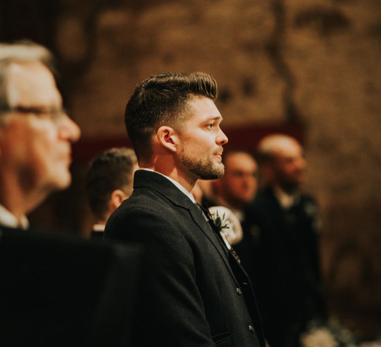 Groom waits for bride to arrive at wedding cermony