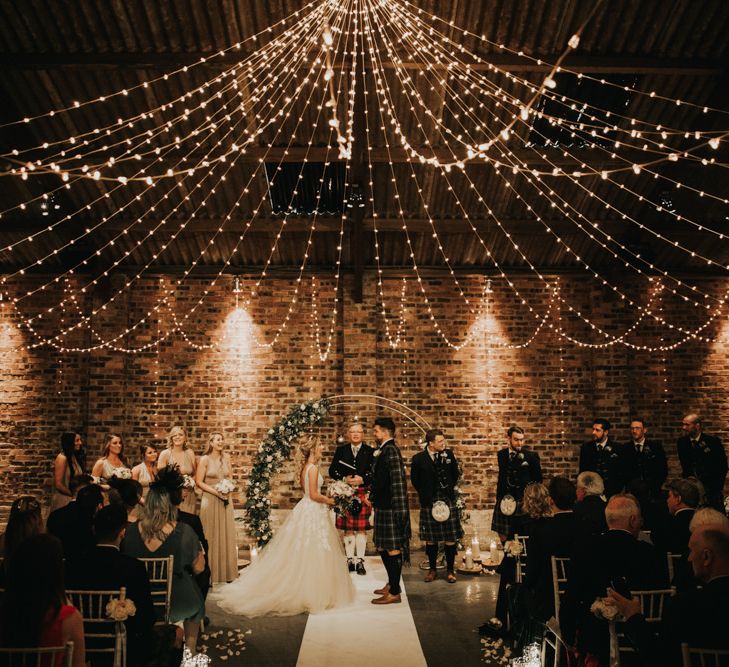 Beautiful wedding ceremony decor with fairy light canopy