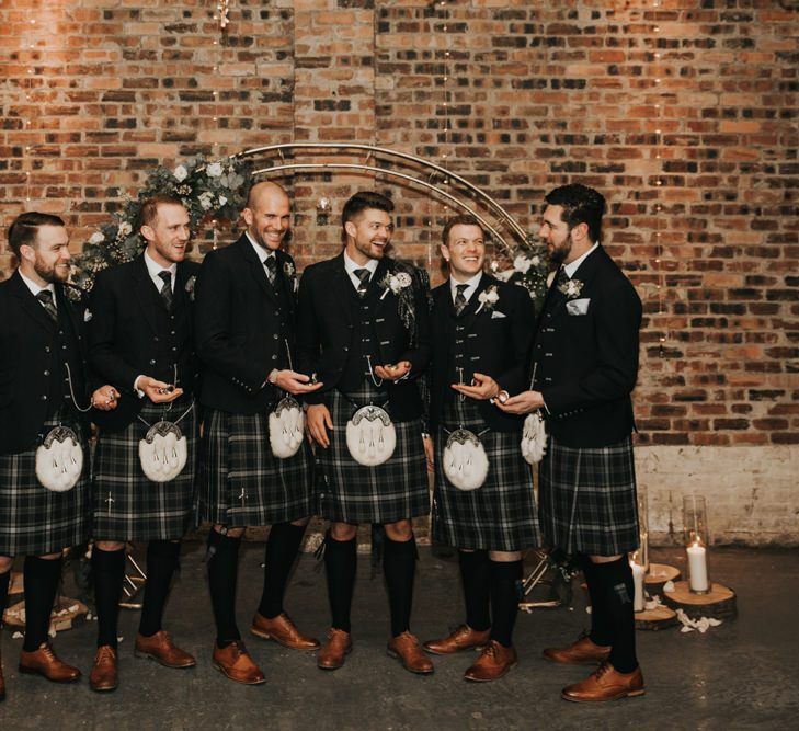 Groomsmen in traditional Scottish kilts