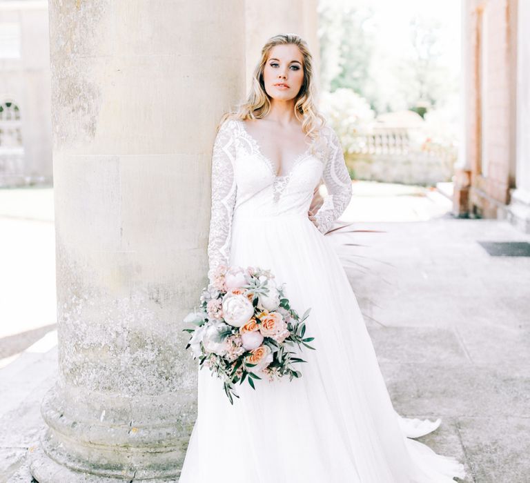 Bride in Lace Wedding Dress Holding White Peony and Peach David Austin Rose Wedding Bouquet