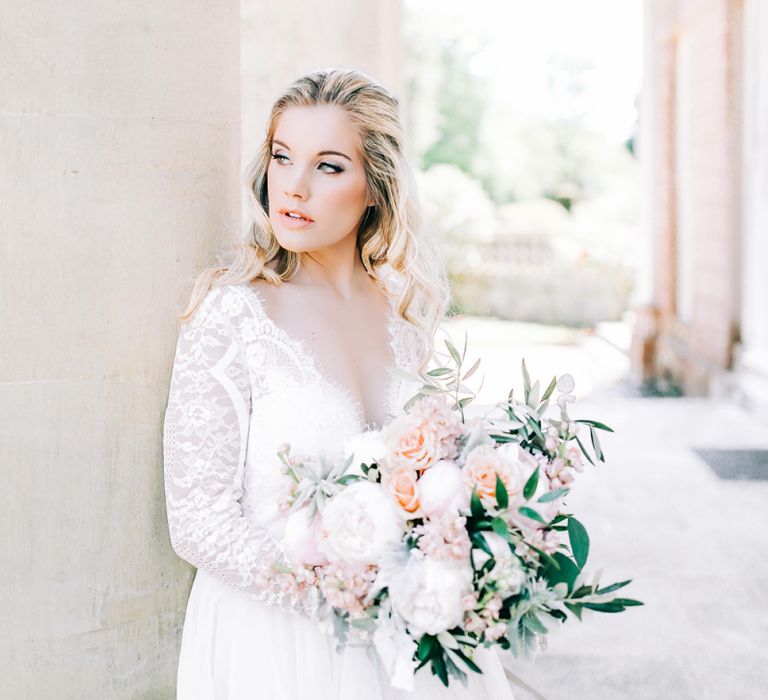 Bride in Lace Wedding Dress Holding White Peony and Peach David Austin Rose Wedding Bouquet